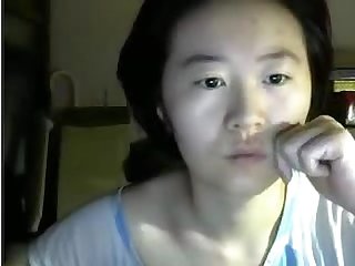 Plain looking asian lady not shy to flash on cam