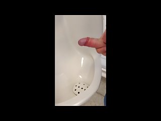 Young boy jerking and cumming in urinal