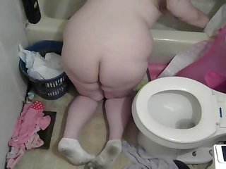 Naked pregnant mom cleaning the bathroom and Toilet