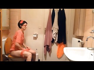 Sexy shy Retro girl is taking shit and piss