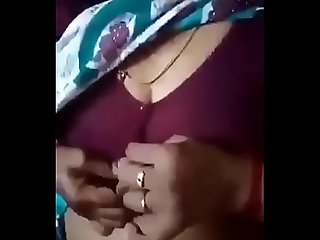 Indian Aunty is showing her boobs to nephew. Nephew is capturing it & kissing her.