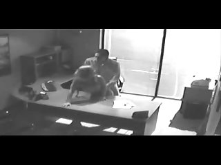 Security camera films sex at office on desk