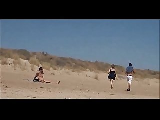 Couple split by strangers and fuck her on nude beach