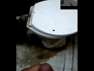 Indian cumming in a dirty bathroom