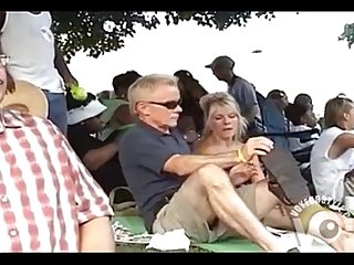 Casual upskirt in the park with a blonde milf