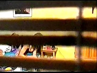 Spy cam peeping at girl through window