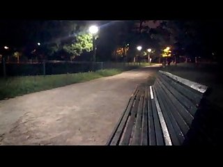 A young guy strips totally in a public park - (almost ?) caught by cyclist