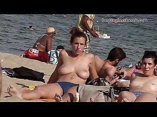 Wonderful busty babe goes Topless on the Beach
