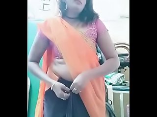 Swathi naidu sexy and romantic seducing in orange saree