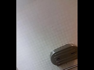 Guy caught jacking off in public restroom.